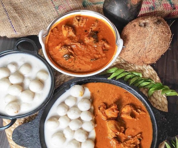 Rice dumplings of kerala dipped in chicken masala?